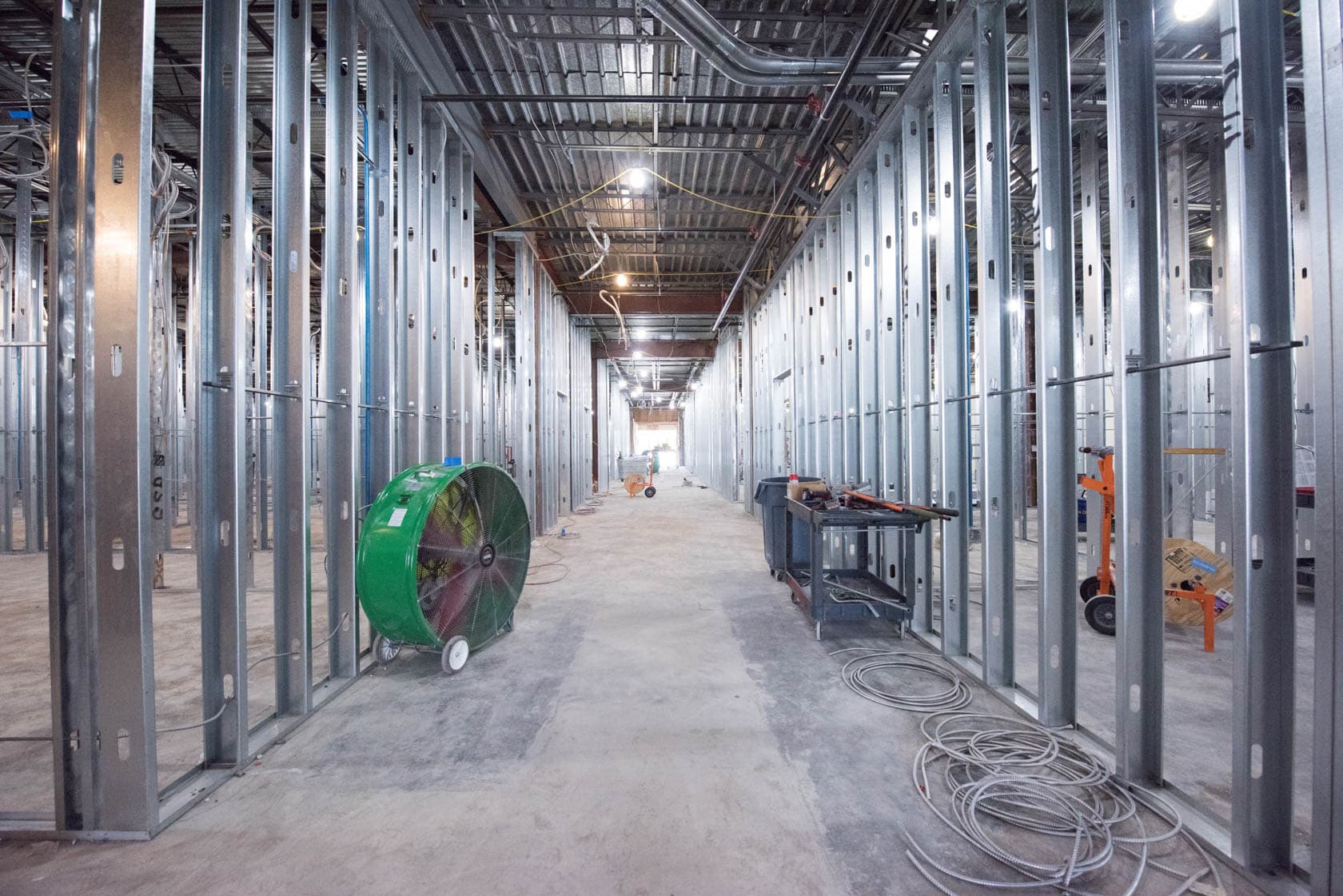 LCS crew on a commercial job site, backdrop to the company's awards and certifications