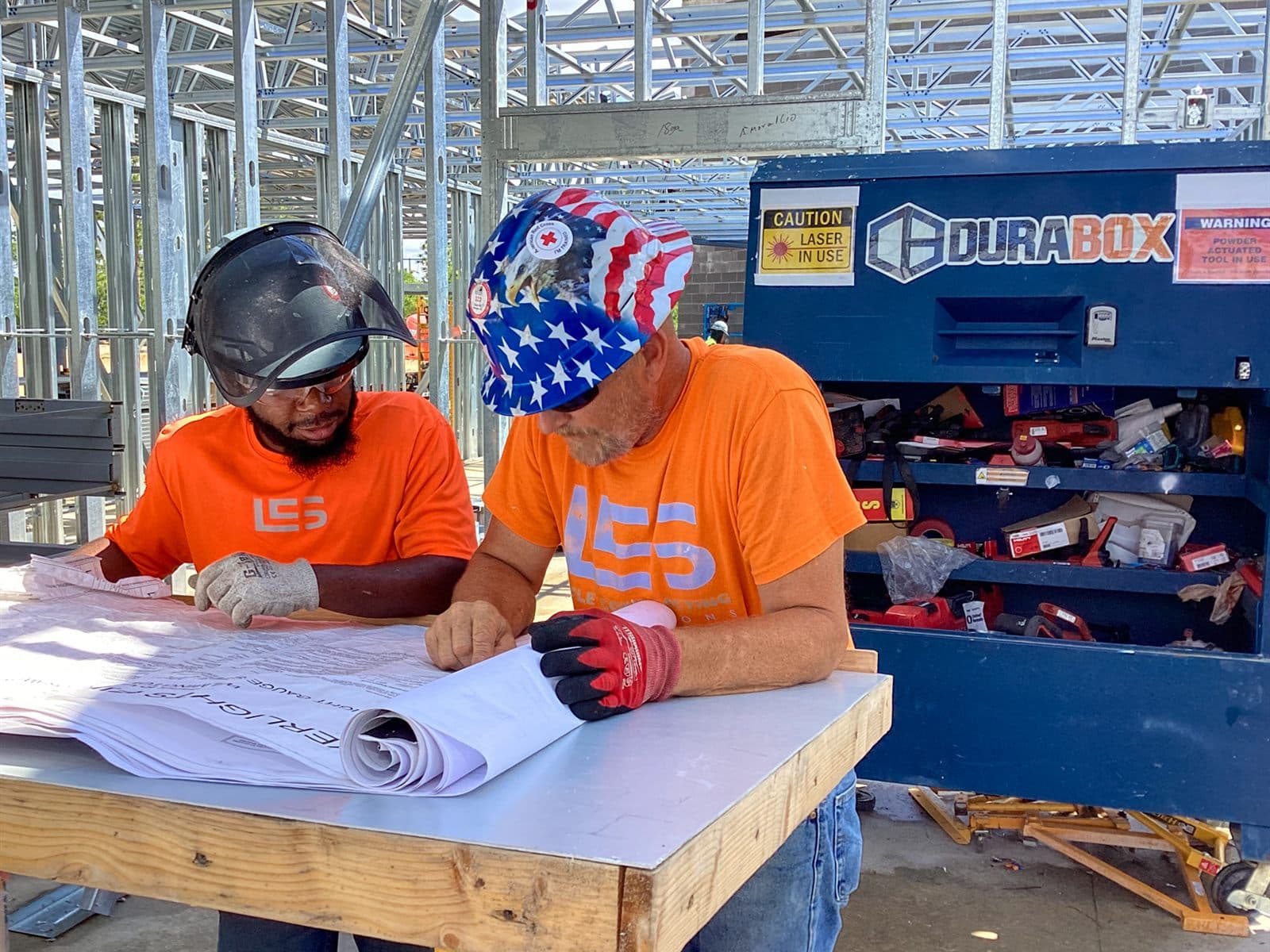 Lyle Contracting Solutions crew reviewing plans on a job site