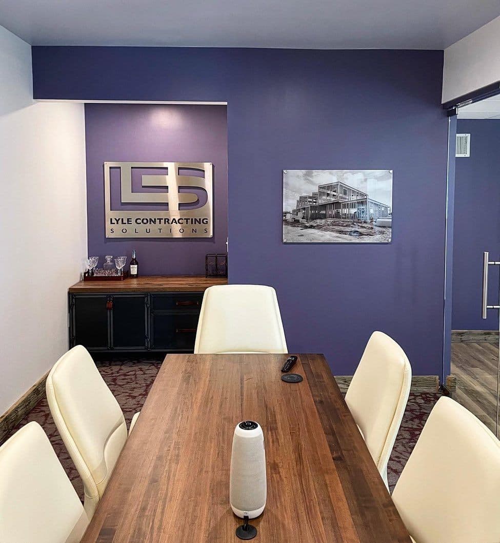 Lyle Contracting Solutions office conference room with the company logo on a feature wall